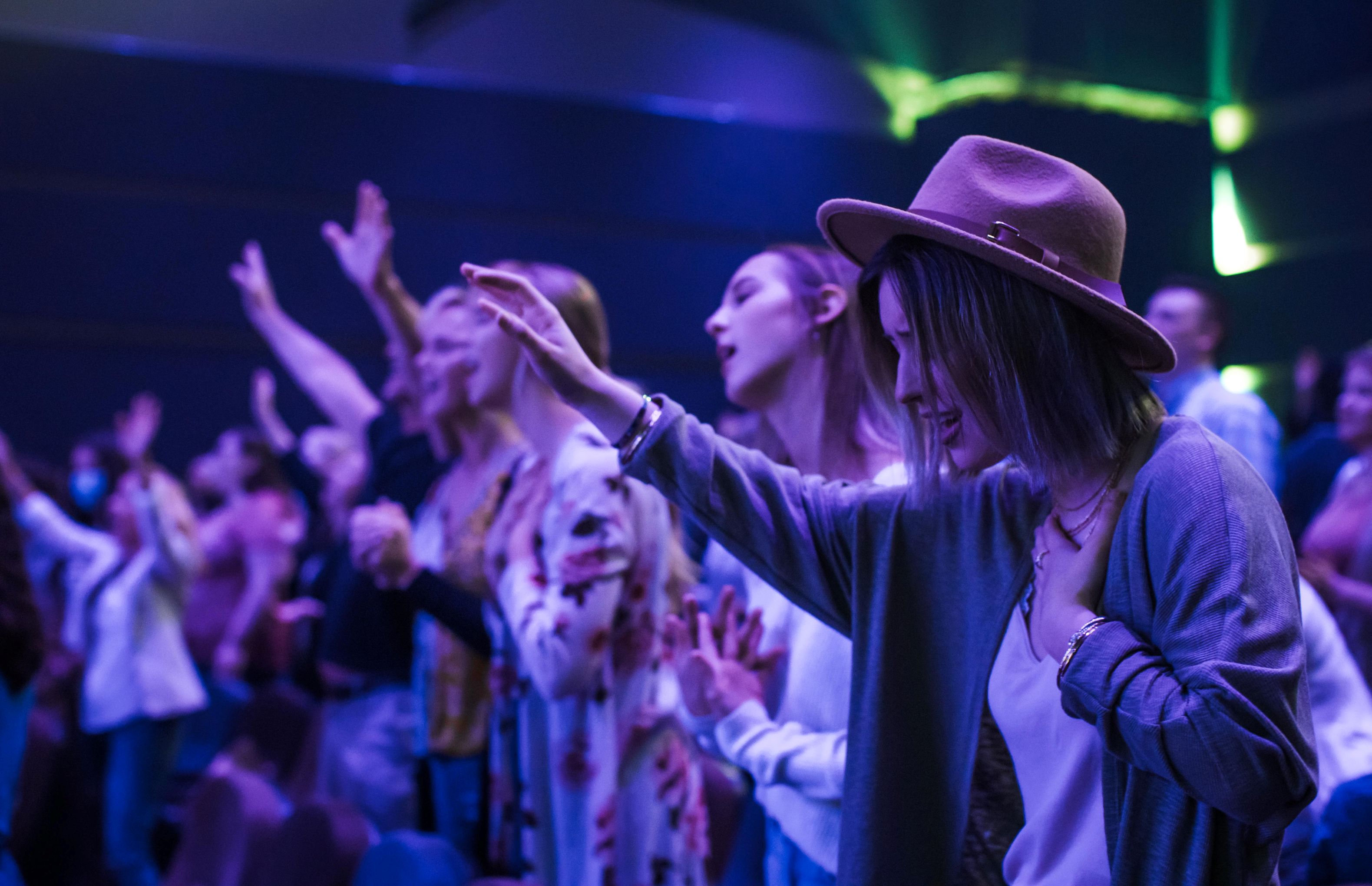 Women with their hands up in praise