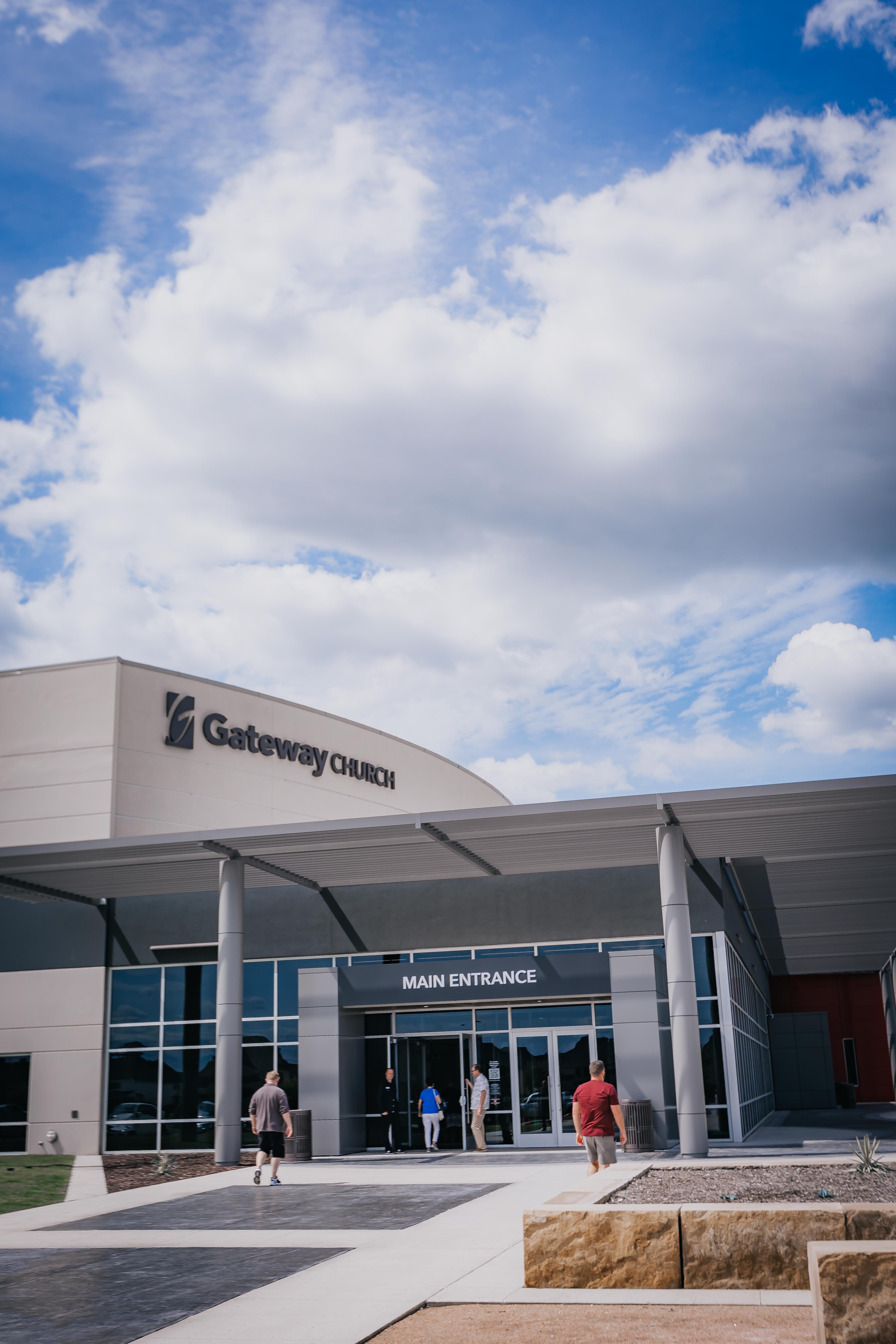 Man sitting at a computer taking notes